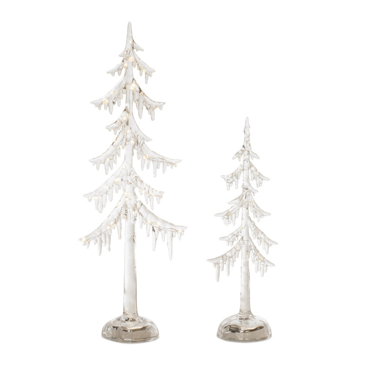 Two clear glass LED trees of different heights with icicle-like branches and warm white lights.