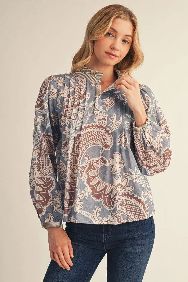 Woman wearing the Adeline Long Sleeves Boho Paisley Floral Top in blue and brown with dark jeans.