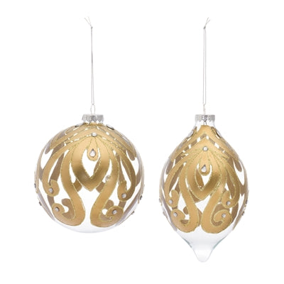 Clear glass Christmas ornaments with gold scroll pattern and rhinestones. One is round, the other is teardrop-shaped.