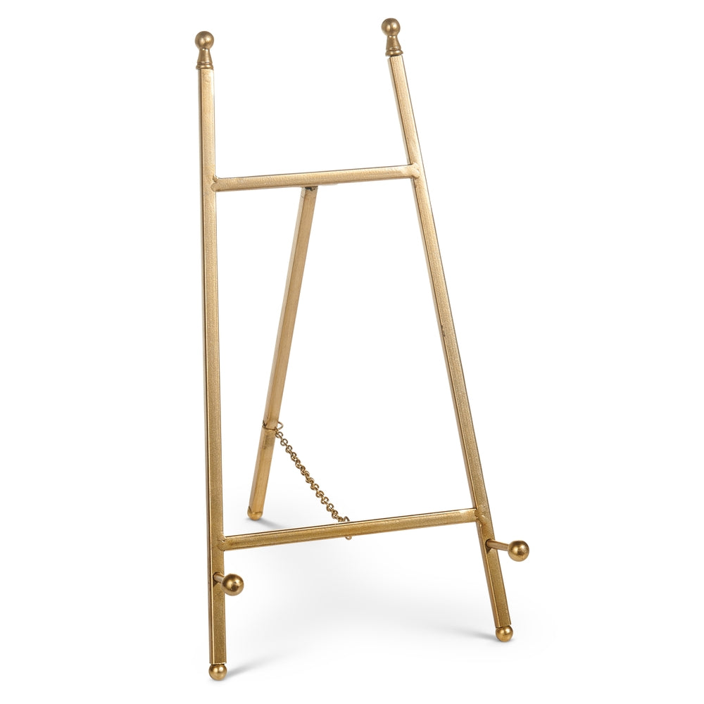 Gold iron easel stand displaying artwork
