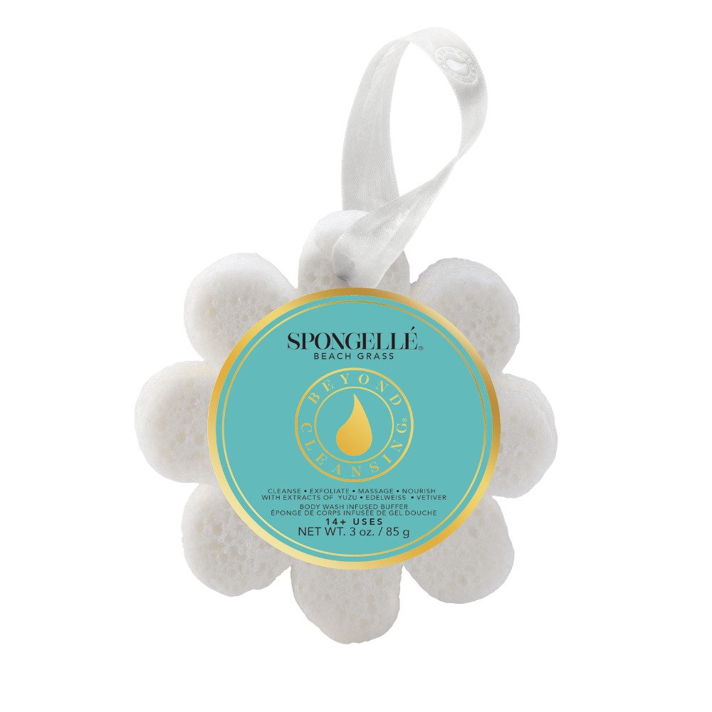 White flower-shaped body wash infused buffer with a teal label and white hanging ribbon.