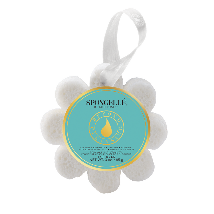 White flower-shaped body wash infused buffer with a teal label and white hanging ribbon.