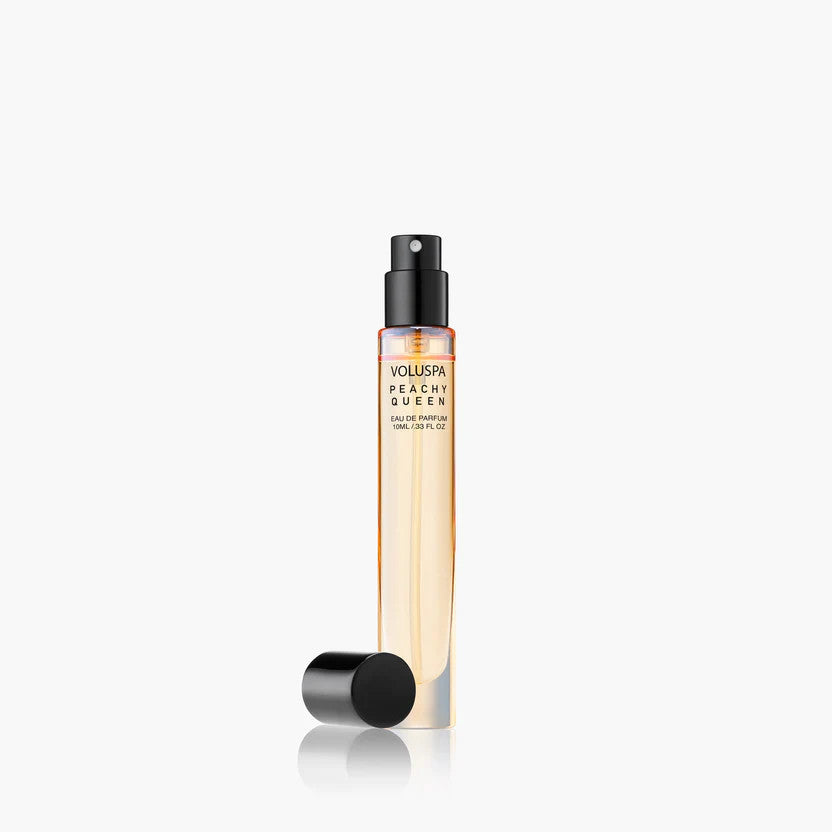 Voluspa Peachy Queen 10ml Eau De Parfum travel spray bottle with black cap removed.