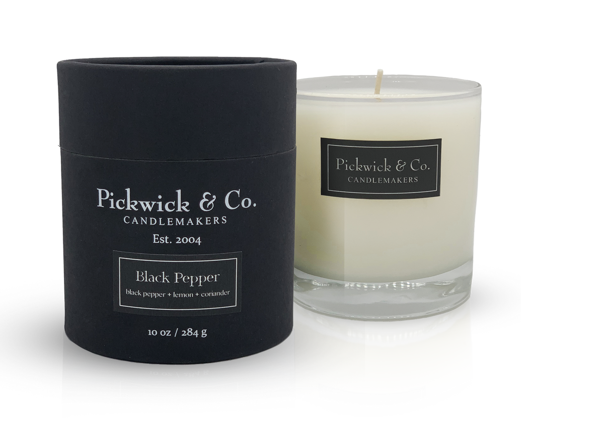 Pickwick Candle in a clear glass jar with a white wick.