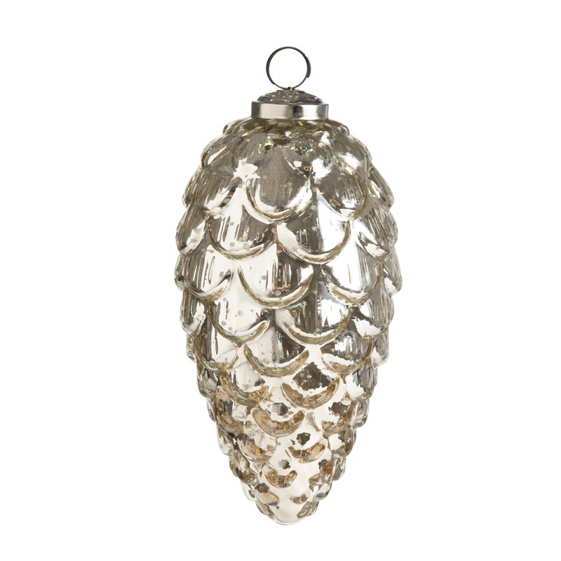 7-inch pinecone-shaped ornament made of burnished mercury glass with a silver metal hanging loop.