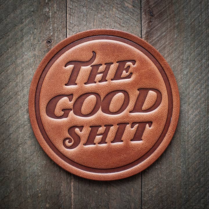 Square leather coaster with a natural patina finish