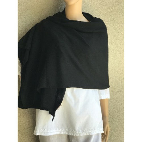 Solid cashmere scarf in a neutral tone with soft drape.