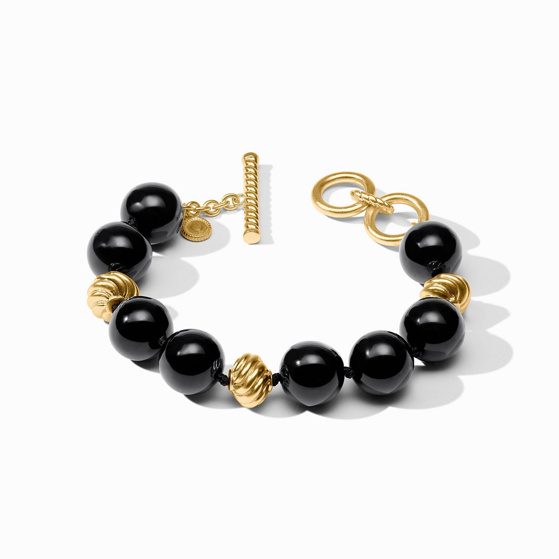 Ravello Bracelet featuring black resin beads and 24K gold-plated textured accents with toggle closure