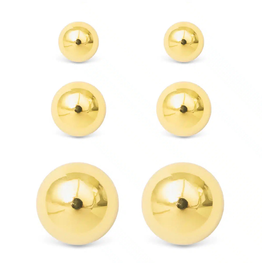 Three pairs of polished gold ball stud earrings in small, medium, and large sizes.