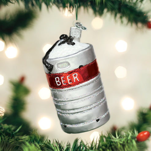 Silver aluminum beer keg Christmas ornament with a red band and white foam on top.