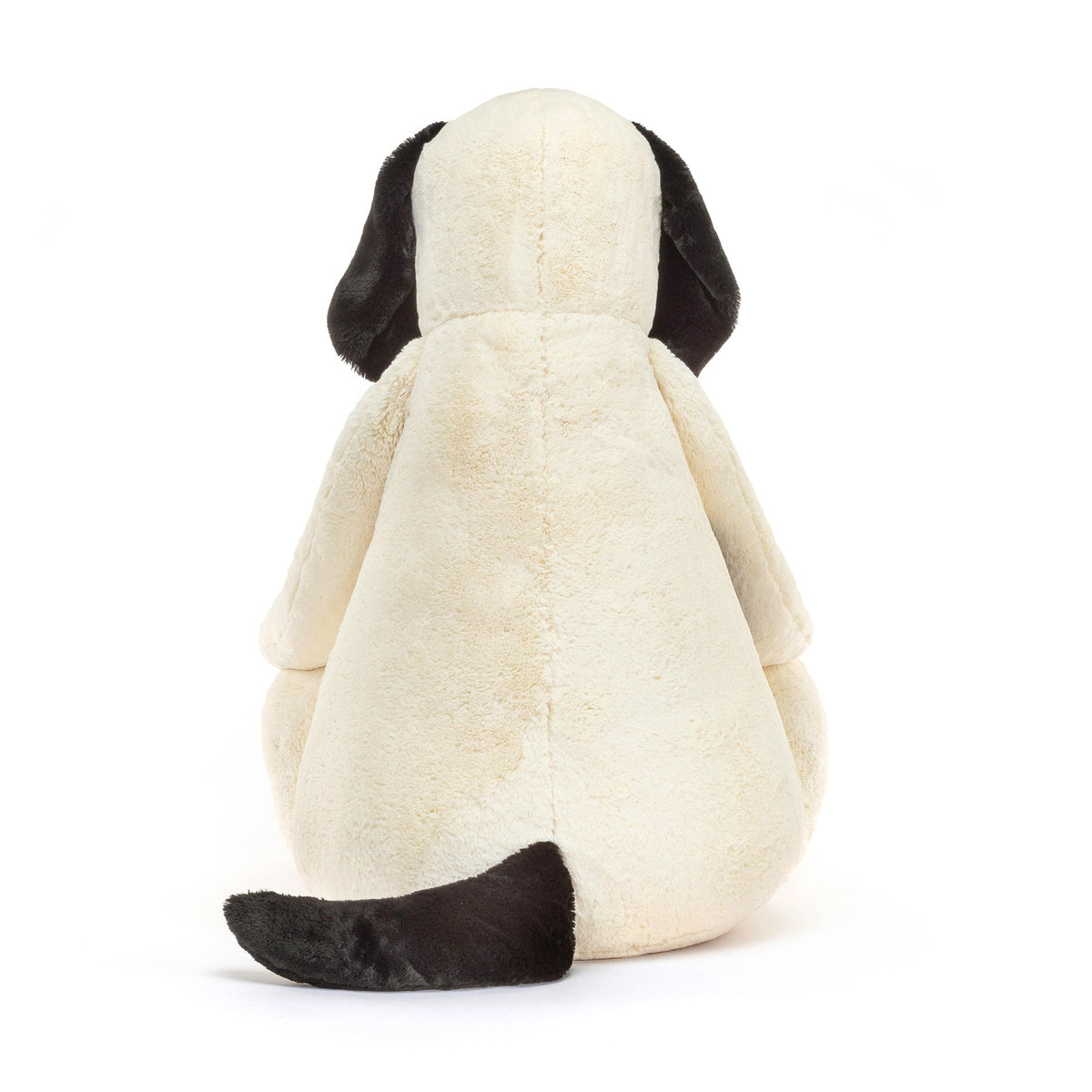 Bashful Black and cream puppy plush toy with polyester fabric filling.
