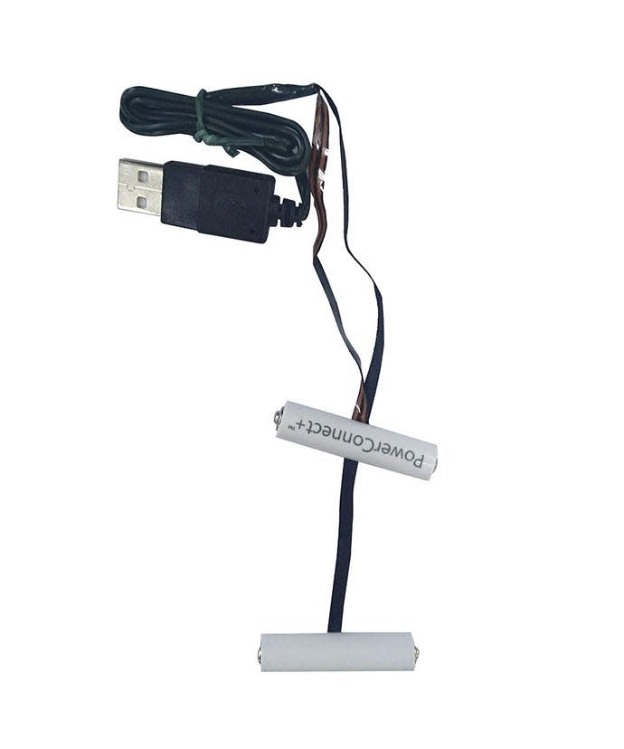 Inside view of the USB PowerConnect+ AAA Converter showing internal components.