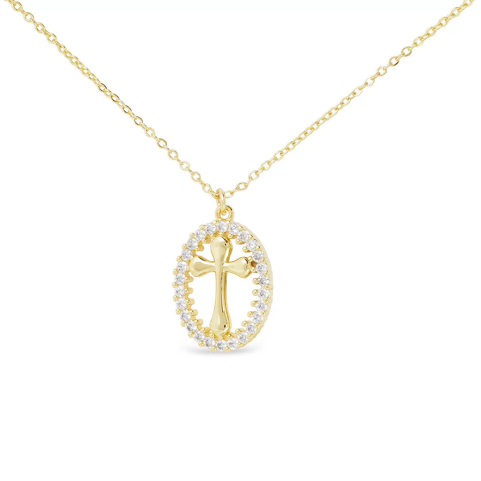 Gold oval pendant necklace featuring a polished cross surrounded by a cubic zirconia halo.