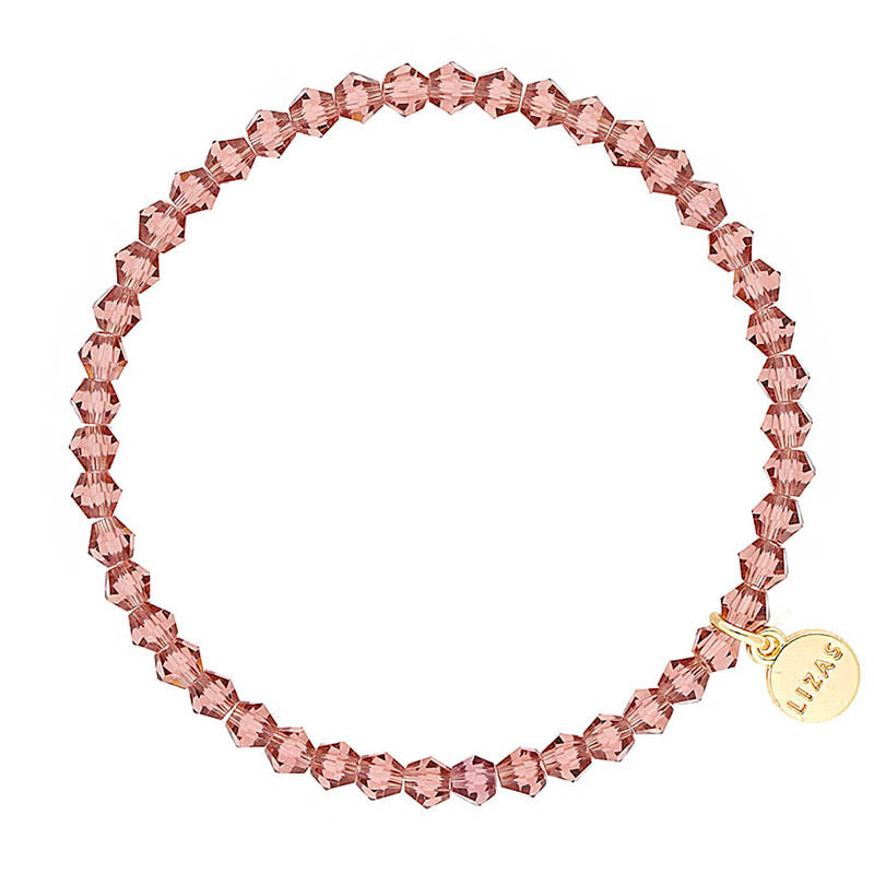 Lizas Quadro Big Bright Colours stretch bracelet with faceted rose pink crystal beads and gold tag.