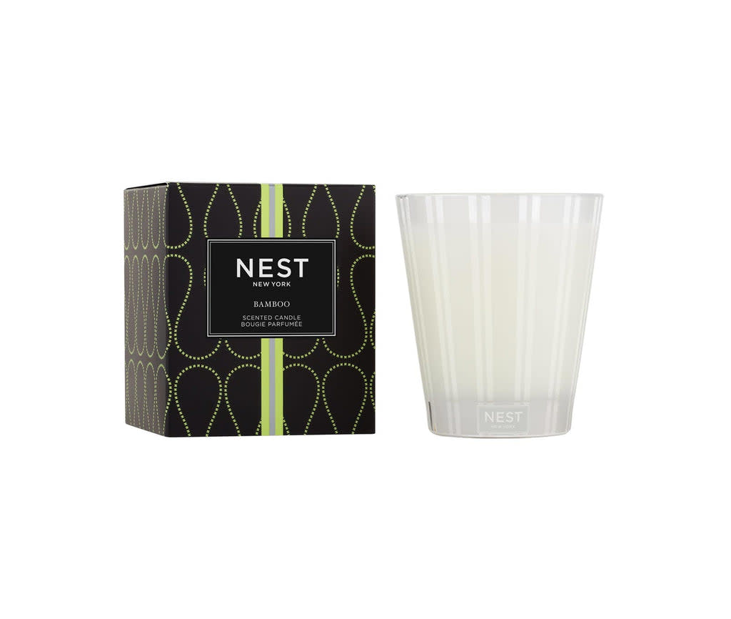 Nest Classic Candle in a clear glass vessel with an off-white wax pillar.