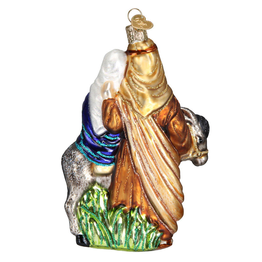 Glass Flight to Egypt ornament featuring Mary and baby Jesus on a donkey led by Joseph.