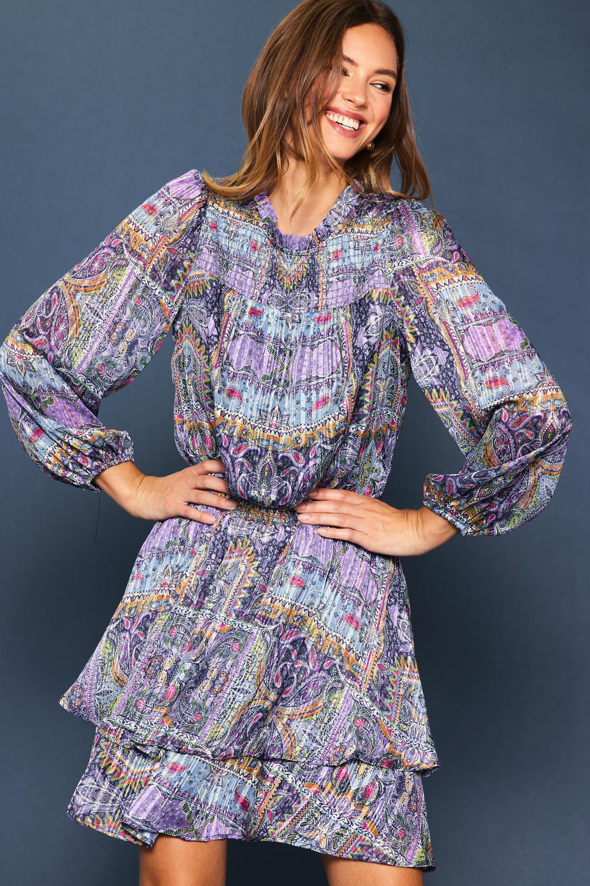 Lydia long sleeve mini dress in printed polyester with a fitted silhouette.
