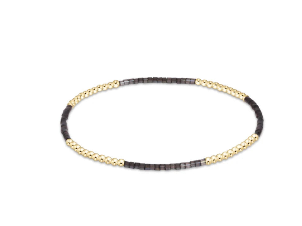 Hope Blissful Bracelet with alternating 2mm gold-filled beads and dark grey seed beads.
