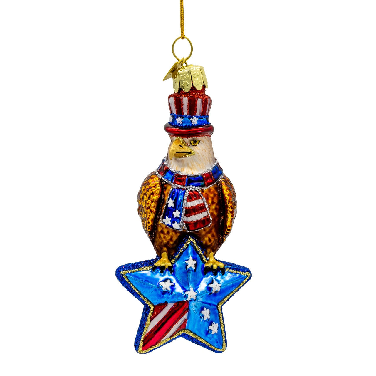 Noble Gems glass American eagle ornament wearing a patriotic hat and scarf, perched on a blue star.