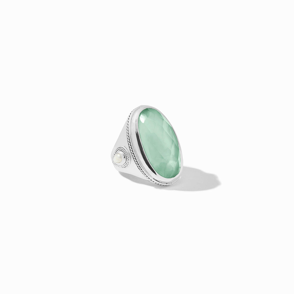 Silver plate ring with imported glass stone and shell pearl accent featuring a statement silhouette.