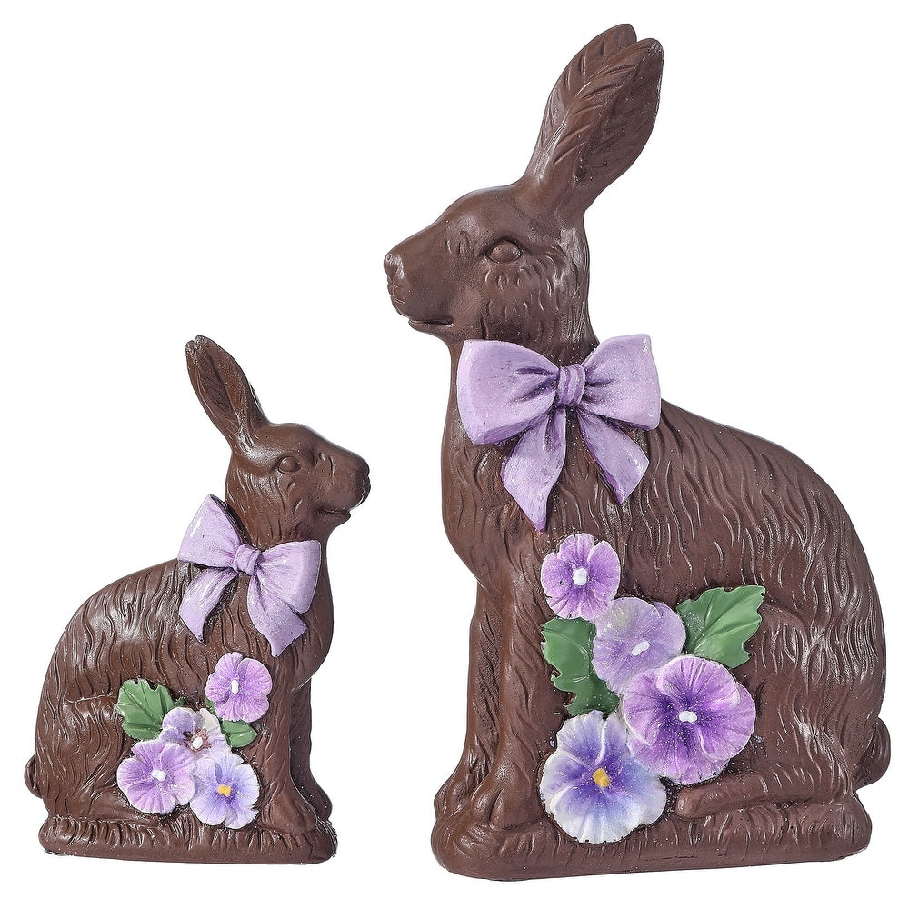 Resin chocolate bunny figurine with a purple pansy flower accent on its ear.