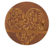 Close-up of an 8 inch brown leather journal with a large embossed floral heart design.