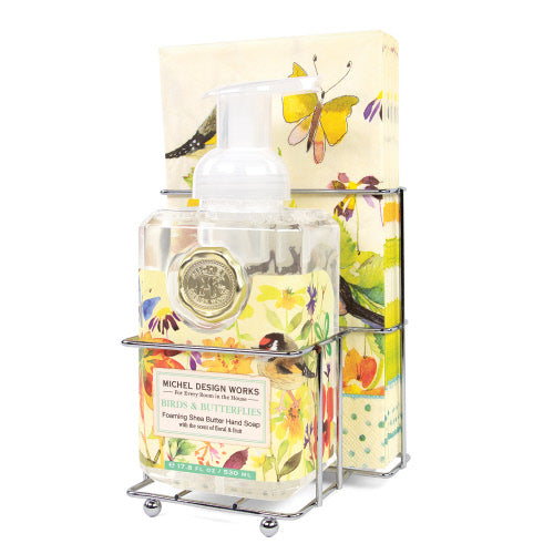 Foaming soap napkin set with compact dispenser holding white liquid soap.