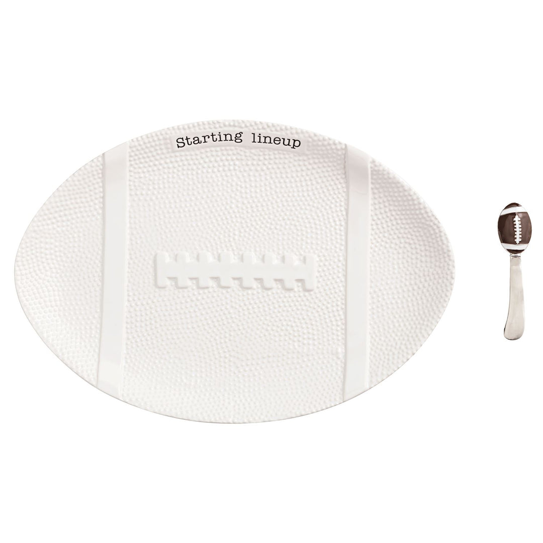 White textured football-shaped platter with 'Starting lineup' text and a football-themed spreader.