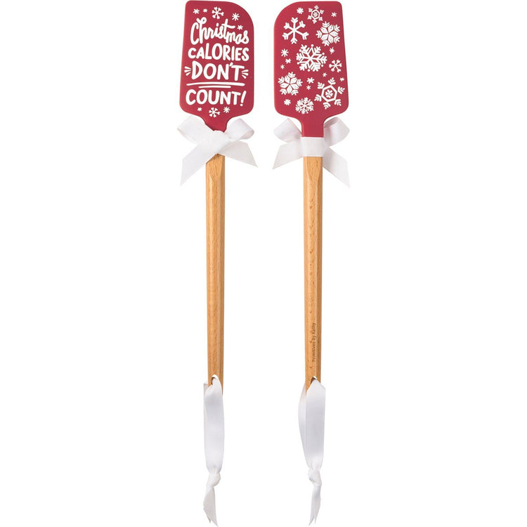 Wood-handled silicone spatula with red Christmas-themed blade.