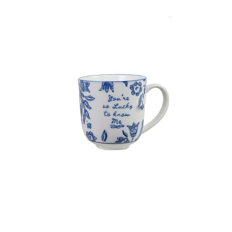 Blue and white stoneware mug with floral designs and the text "You're so Lucky to know Me".