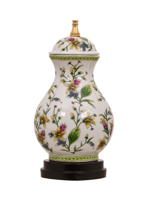 Porcelain tulip-shaped lamp with floral scallop patterns in a soft pastel hue.