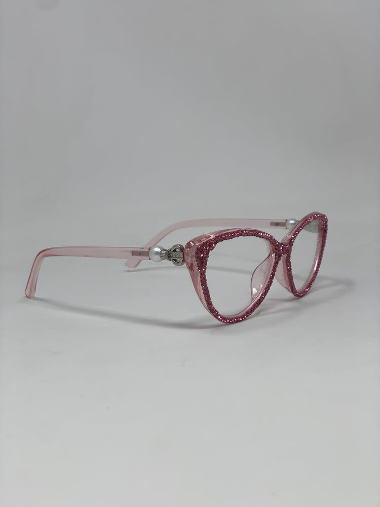 Pink cat-eye reading glasses with rhinestone-encrusted frames and pearl accents on the temples.