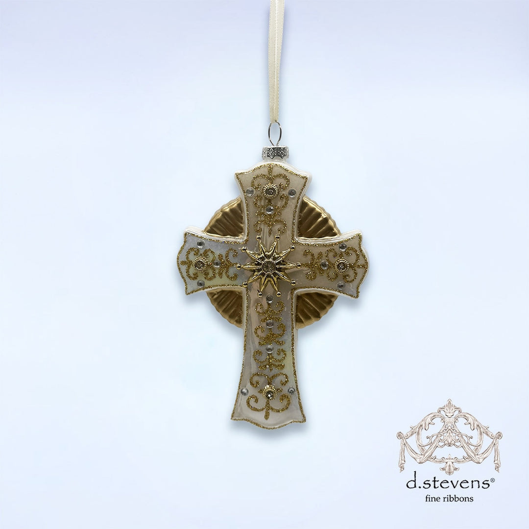6.25-inch white glass cross ornament with gold glitter filigree and clear stone accents.
