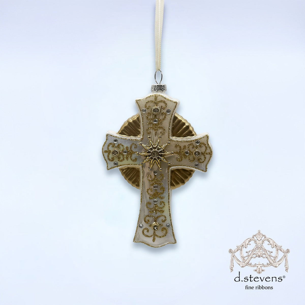 6.25-inch white glass cross ornament with gold glitter filigree and clear stone accents.