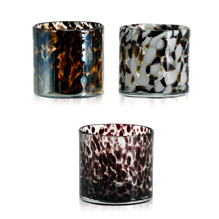 Set of three multicolor glass vases with tortoiseshell, white, and purple speckled patterns.