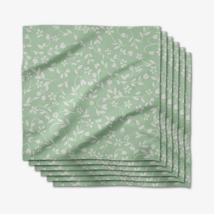 Set of six square Geosuede dinner napkins with single-sided geometric print in neutral tones.