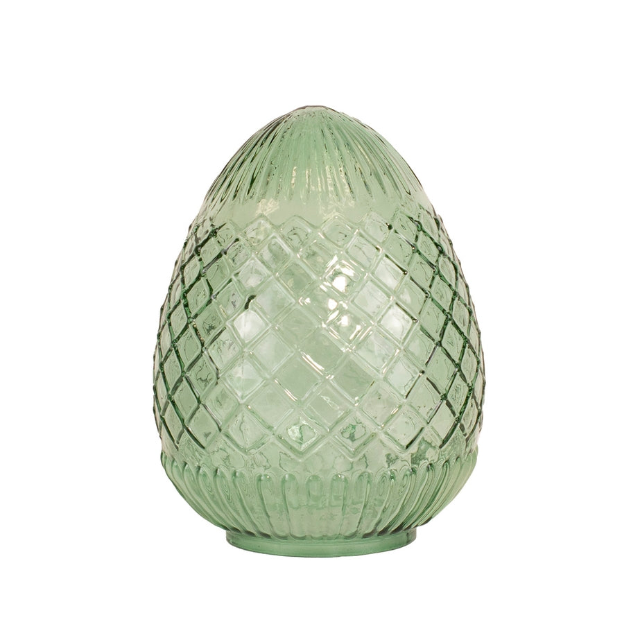 Handcrafted glass egg with vivid hue and intricate surface details.