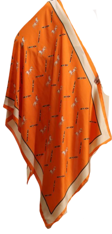 Orange reversible wrap with a white horse and belt pattern and a cream border.