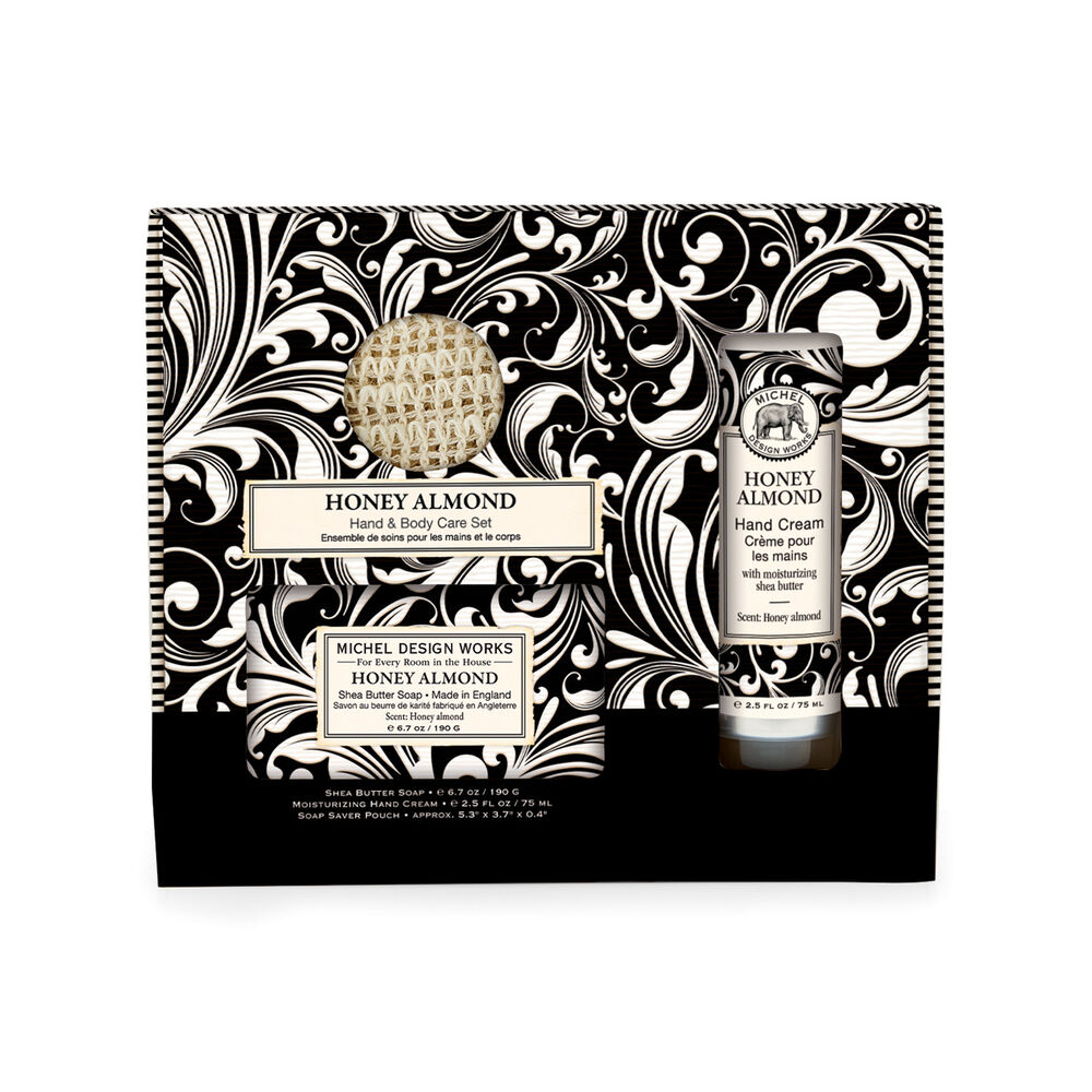 Gift box containing hand cream and body lotion set in neutral tones.