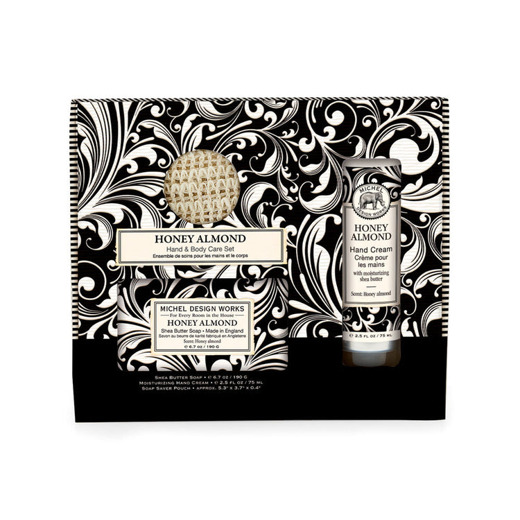 Gift box containing hand cream and body lotion set in neutral tones.