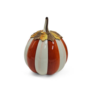 Harvest Glow Paprika Stripe Pumpkin candle in a cylindrical glass jar with an orange and white striped label.