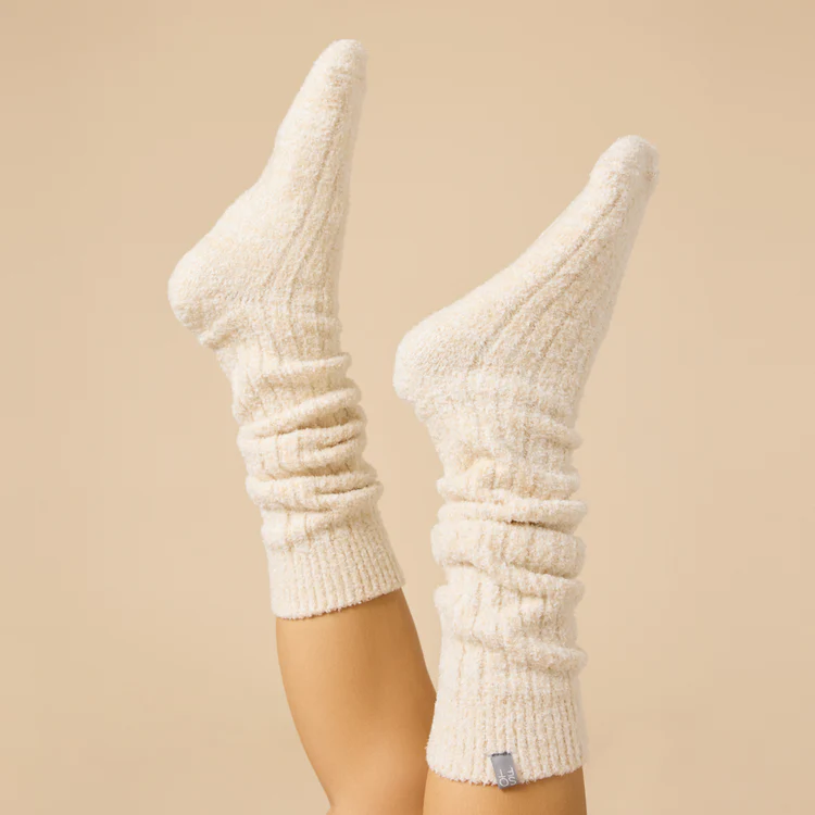 Slouchy marshmallow socks in heathered gray with non-slip grippers on the sole.