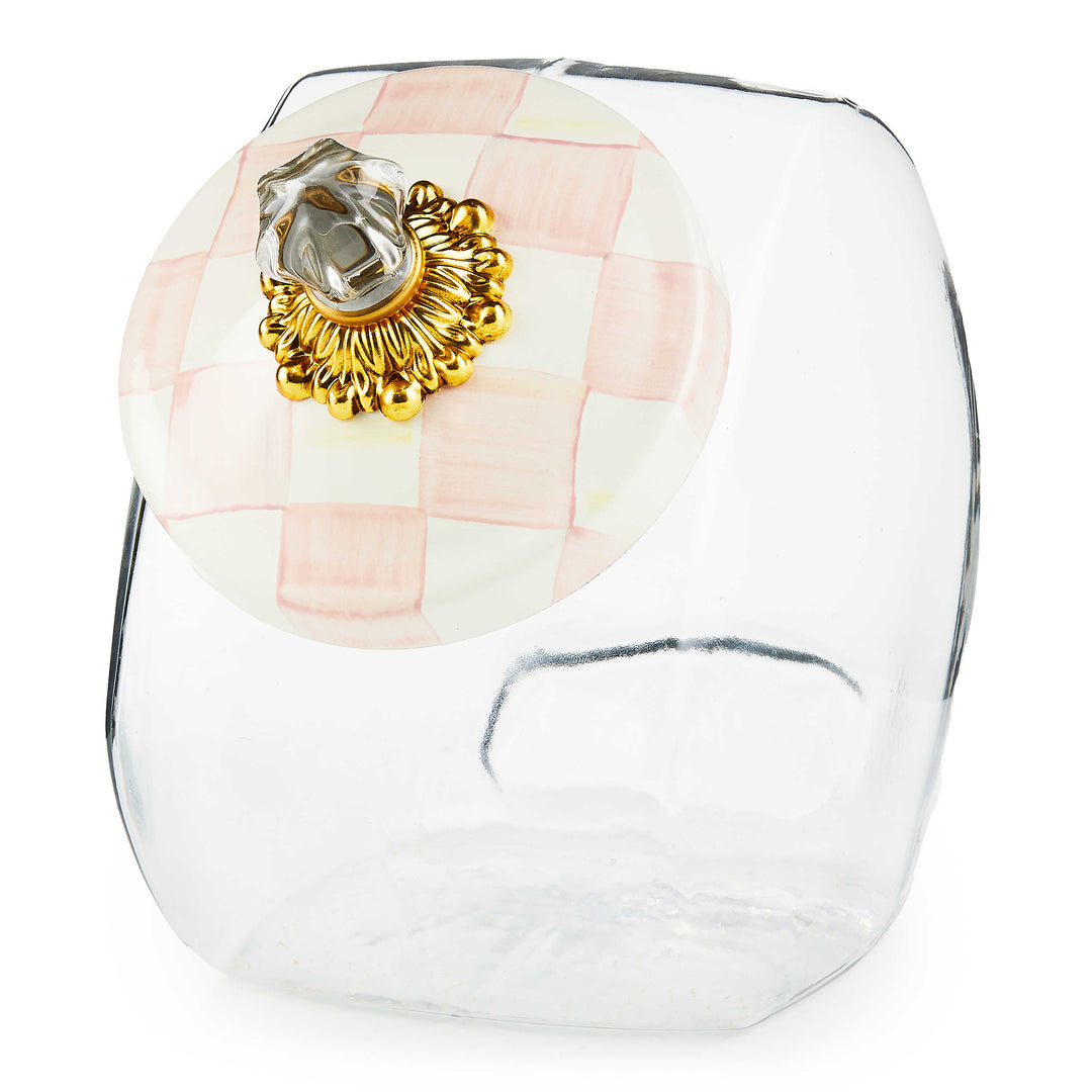Glass cookie jar with rosy check hand-painted lid featuring brass hardware