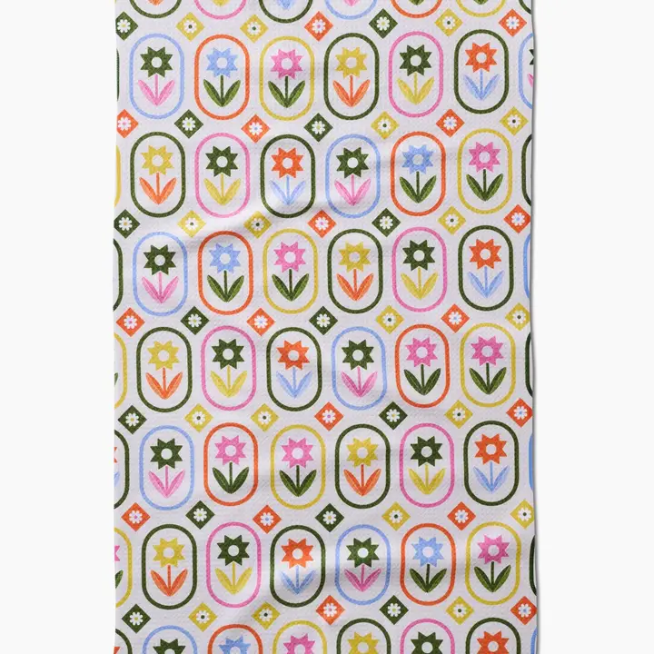 Spring tea towel with petal patchwork print on waffle weave recycled polyester