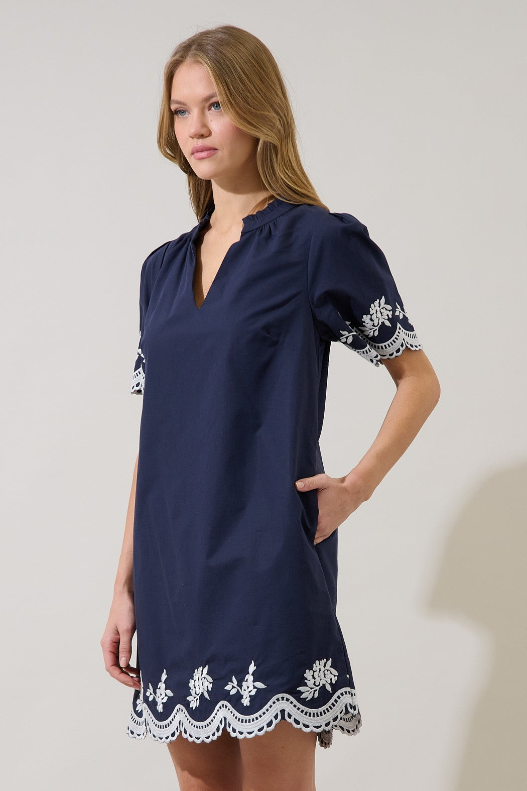 Melania embroidered shift mini dress in light beige with short sleeves.