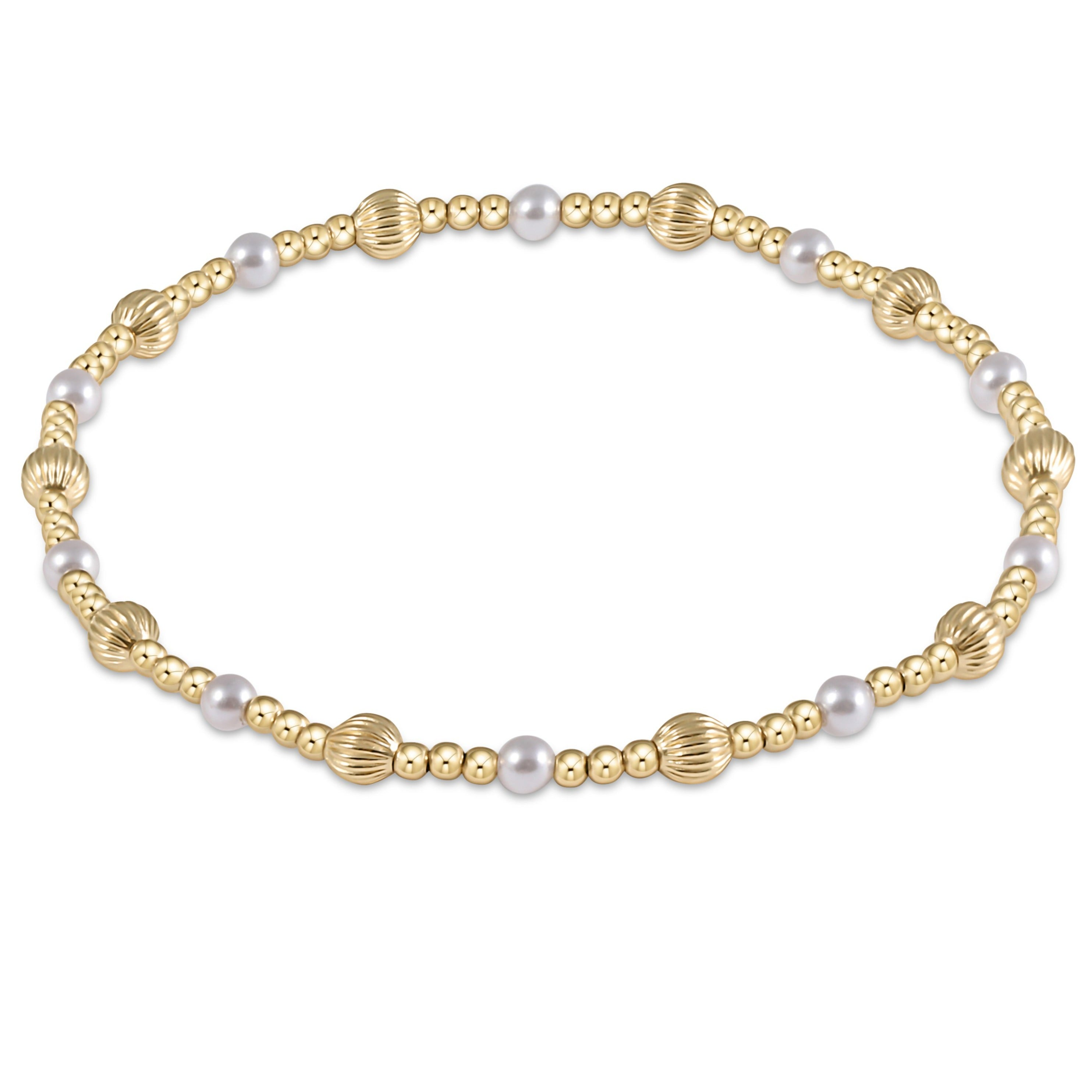 Gold beaded bracelet with 4mm gold-filled beads and white crystal pearls on an elastic band.