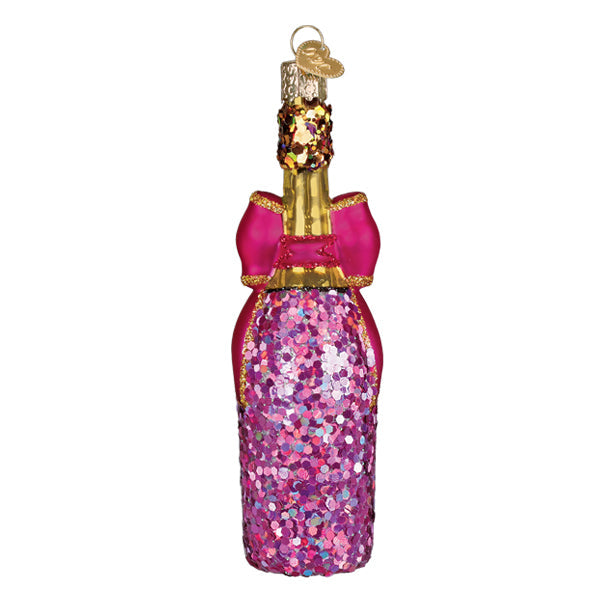 Champagne bottle with a glittering bow ornament around its neck.
