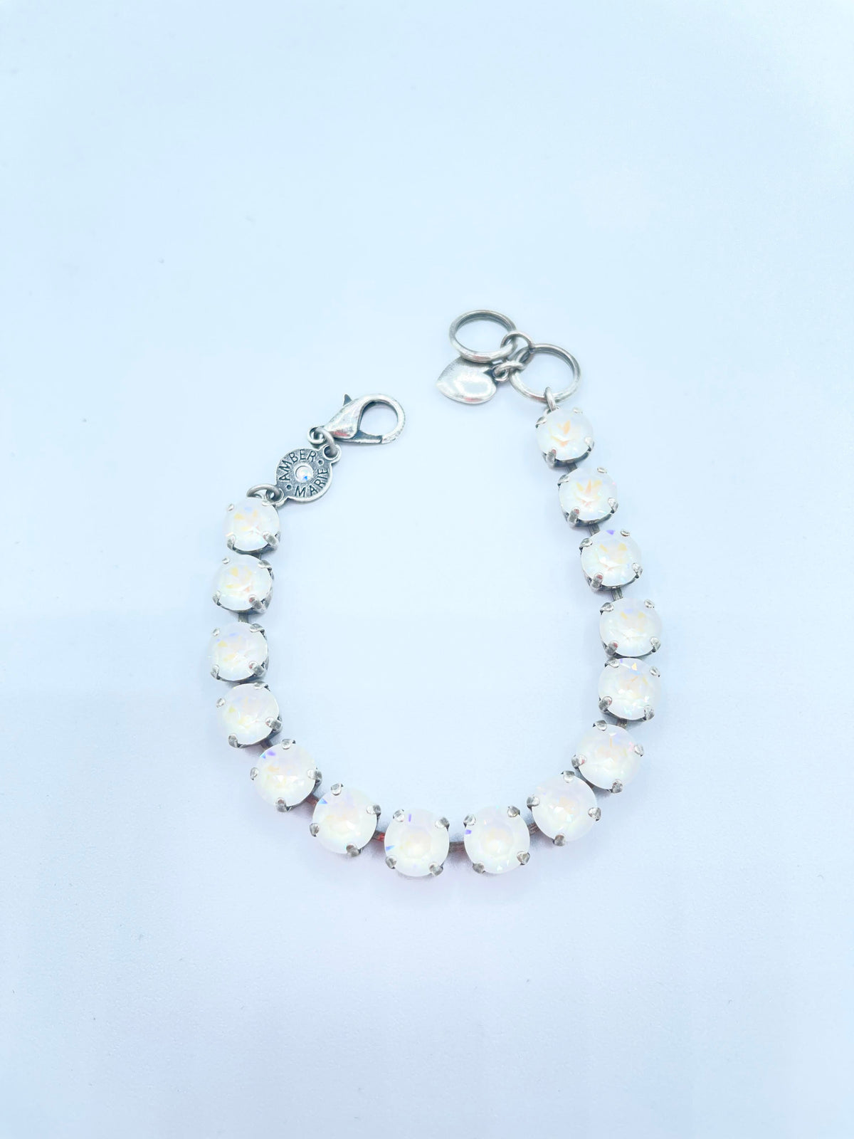 Lavender, lilac, white, and light green stone bracelet with amber tag heart charm