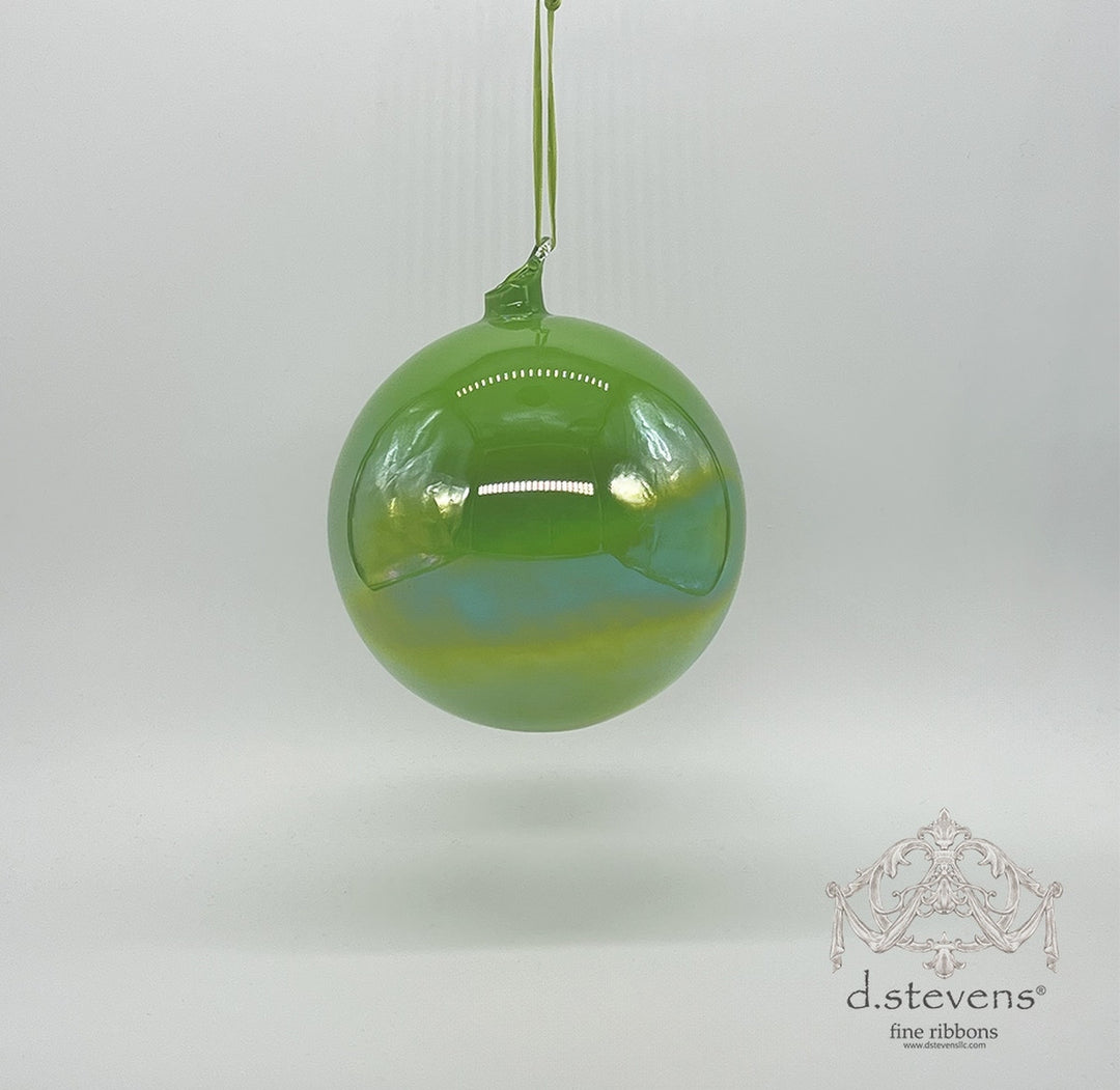 150mm lime green hand-blown glass ornament with a luminous iridescent finish and hanging loop.