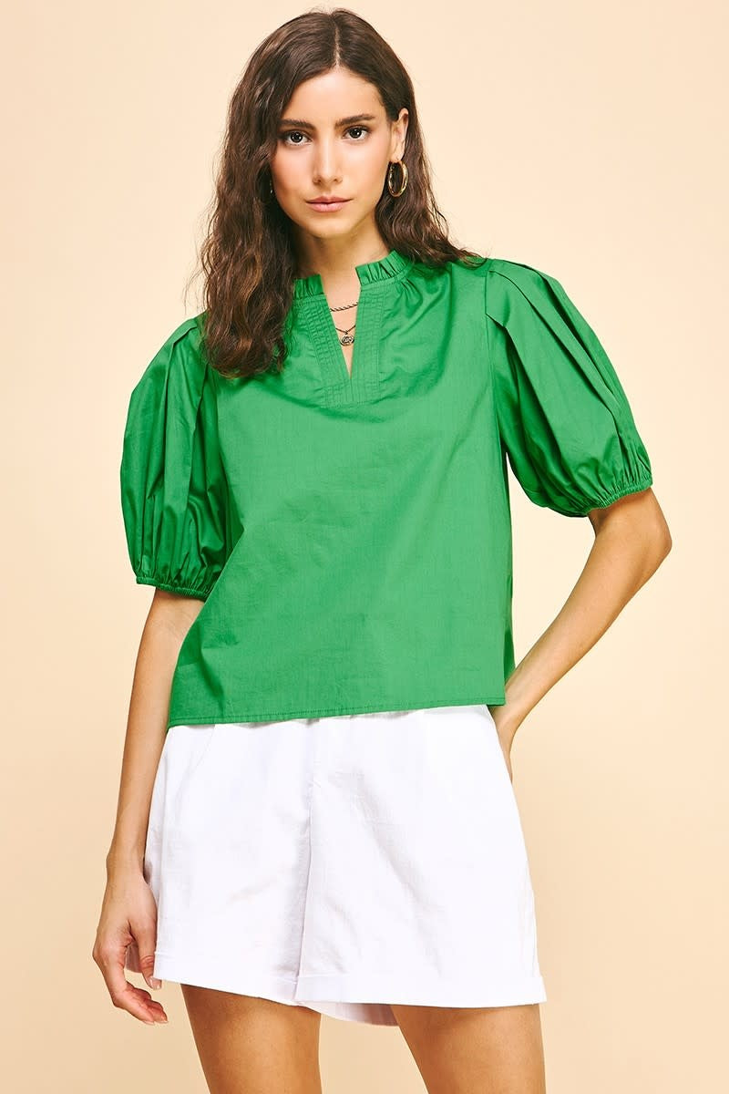 Ivy short sleeve woven top in natural cotton with V-neckline, puff sleeves, and ruffle detail.